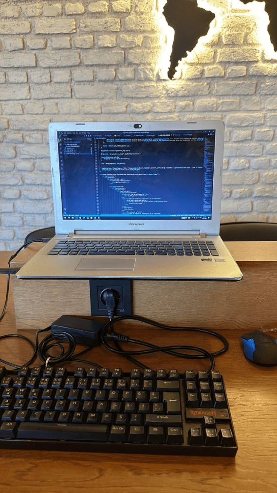 Letket team members coding in a cozy coffeeshop in Dubai.